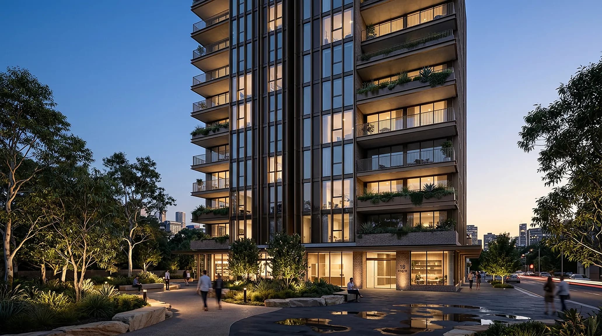 A slender apartment tower at dusk with lit balconies